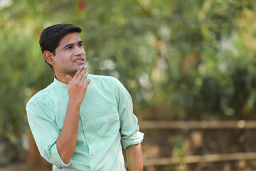 Young indian man thinking some idea