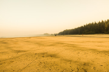 Fototapeta na wymiar The Sunrise on a peaceful, Silent & empty beach