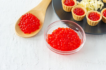 Tartlets with butter and red caviar. Gourmet food, appetizer. Delicatessen. Seafood.