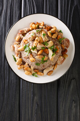 Lebanese Chicken and Rice Riz bi-Djaj closeup in the plate on the table. vertical top view from above