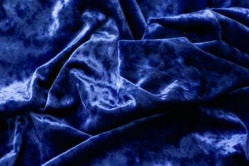 Fabric is velvet in blue. The texture of the velour fabric is blue.