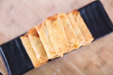Overlooking a plate of fried spring rolls