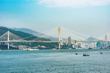 Suspension bridge on the city background. Hong Kong.
