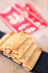 Fried spring rolls and red envelopes for Lichun