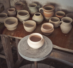 Many clay pot is on the table in pottery