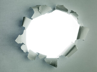 Grey sheet of paper with a round hole  white background inside