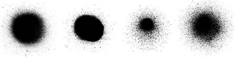 Close-up of several black spray paint spots and splashes, isolated on white background.