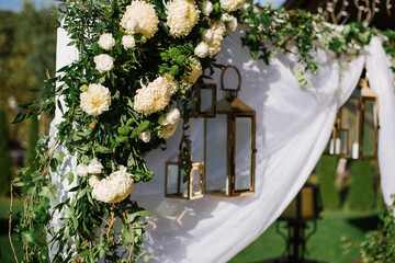 Wedding arch with flower decoration outdoors