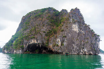 Fototapeta premium Halong bay UNESCO world natural heritage, Vietnam. Tourist cruise ships sailing among limestone mountains in Halong Bay, Vietnam.
