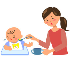 離乳食を嫌う男の赤ちゃんと母親
