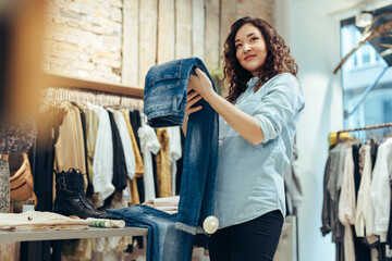 Fototapeta Woman shopping in clothing store obraz