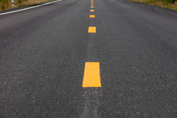 The road surface that is marking a new lane. (background,texture)