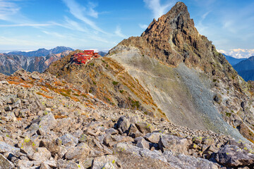 Landscape in the mountains, Yarigatake Lodge and mount Yari on the background. Kamikochi, Japanese Northern Alps
