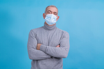  man with disposable medical mask on his face in prevention of virus and infection