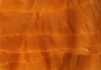 Orange textured material as background, closeup view