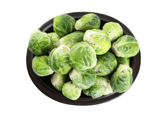 Fototapeta premium Fresh Brussels sprouts in bowl isolated on white, top view