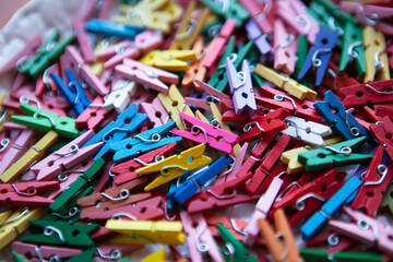 Small colored clothespins for the holidays. Cheerful background.