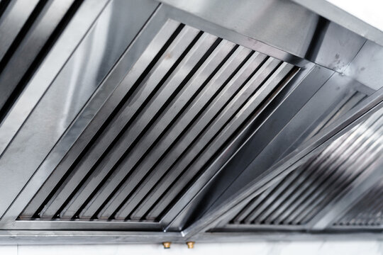 New clean stainless steel hood in professional kitchen