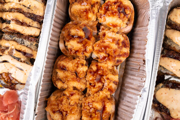 hot sushi roll with grilled cheese in foil