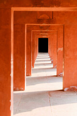 Hallway painted in orange/red color; India
