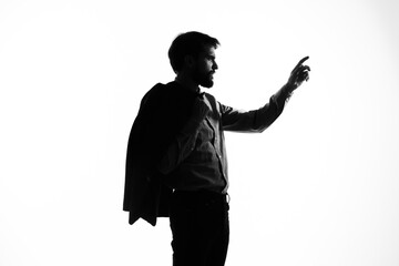 portrait of a man shadow gun in the hands of a detective crime incognito