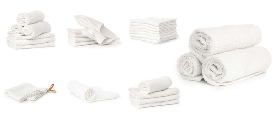 set of white spa towels stacked and in basket isolated on white background