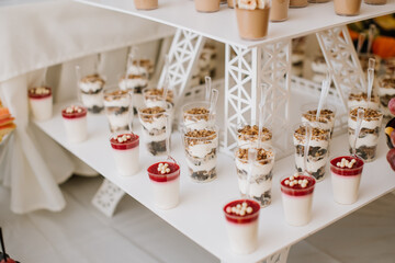 Many different desserts in the candy bar on wedding