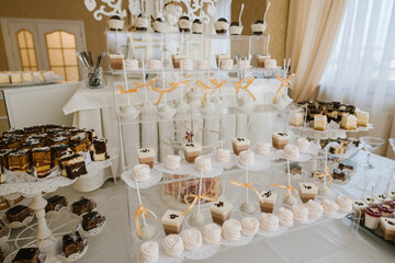 Many different desserts in the candy bar on wedding