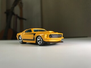 Fototapeta na wymiar Yellow and black muscle toy car