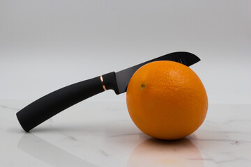 A knife in an orange