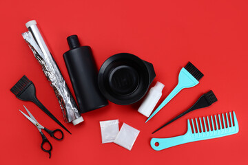 Tools for hair dye, for the hairdresser, topview on red background