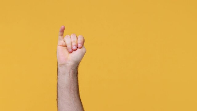 Cropped close up man male hand showing fingers ordinal count from five zero 5 to 0 countdown gesture isolated on yellow background studio. Copy space commercial promo advertisement mock up Advertising