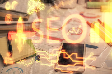 Double exposure of SEO drawing and cell phone background. Concept of data search optimization