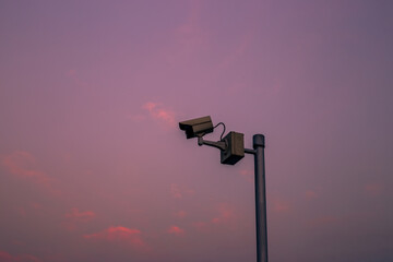 Blurred background of CCTV cameras installed along the condo's rooftop, to ensure the safety of residents and to maintain common property in modern times.