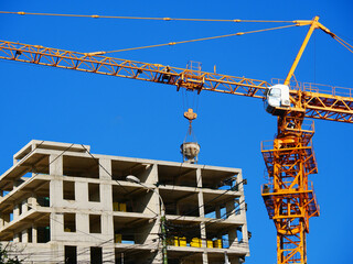 Construction site with crane and Crane near building. Construction site. Industrial background.