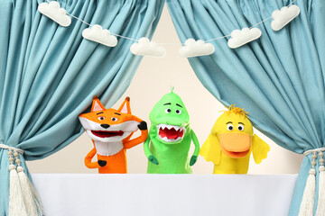 Creative puppet show on white stage indoors