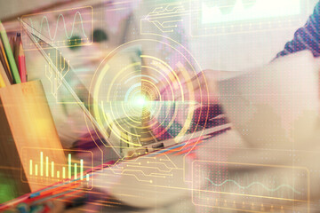 Double exposure of woman hands working on computer and data theme hologram drawing. Tech concept.