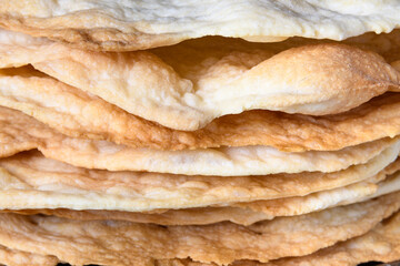 Stack of fresh baked crunchy cakes for Napoleon cake close-up
