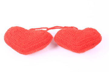 two knitted hearts on a white background. creative valentines day concept