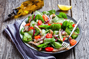 Salad of chicken, baby spinach and cherry tomatoes