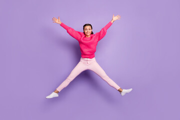 Full size photo of cheerful happy young woman jump up air star shape isolated on violet color background