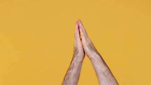 Cropped Close Up Man Fan Admirer Viewer Male Applause Cheering Clapping Hands Showing Two Thumbs Up Gesture Isolated On Yellow Background Studio. Copy Space Commercial Promo Advertisement Area Mock Up