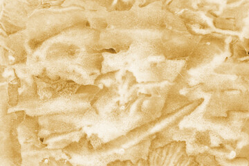 Gold ink and watercolor texture on white paper background. Paint leaks and decalcomania effects. Hand-painted gouache abstract image. Mess on the canvas.