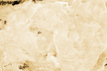 Gold ink and watercolor texture on white paper background. Paint leaks and decalcomania effects. Hand-painted gouache abstract image. Mess on the canvas.