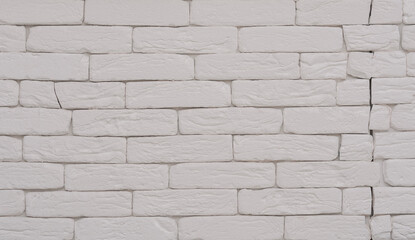White brick wall with crack.Copy space for text.
