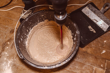 preparing a mortar plaster stirring mix water consistency emulsion finishing