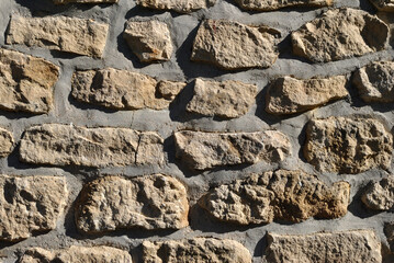 Close Up of Rough Rocks in Stone Wall 