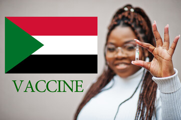 African woman show vaccine for Republic of the Sudan. Vaccination of Africa countries concept.