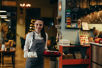 waitress cleaning table in cafeteria