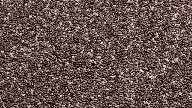 rotating chia seeds background top view